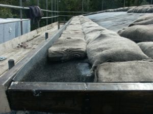 Shows the liner, barge boards and sand bags.
